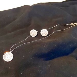 Sterling silver pendant and matching earrings set.